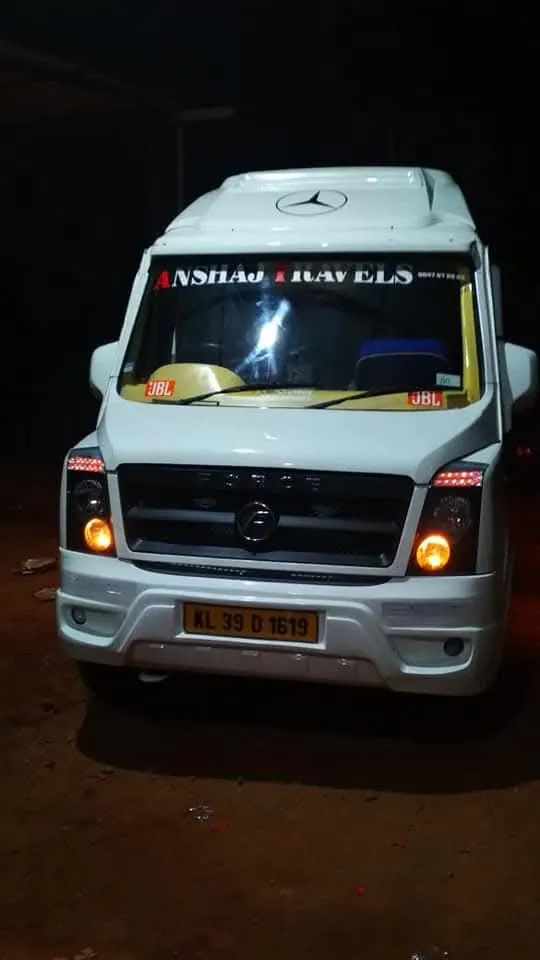 Anshaj Travels tempo traveller lit up at night