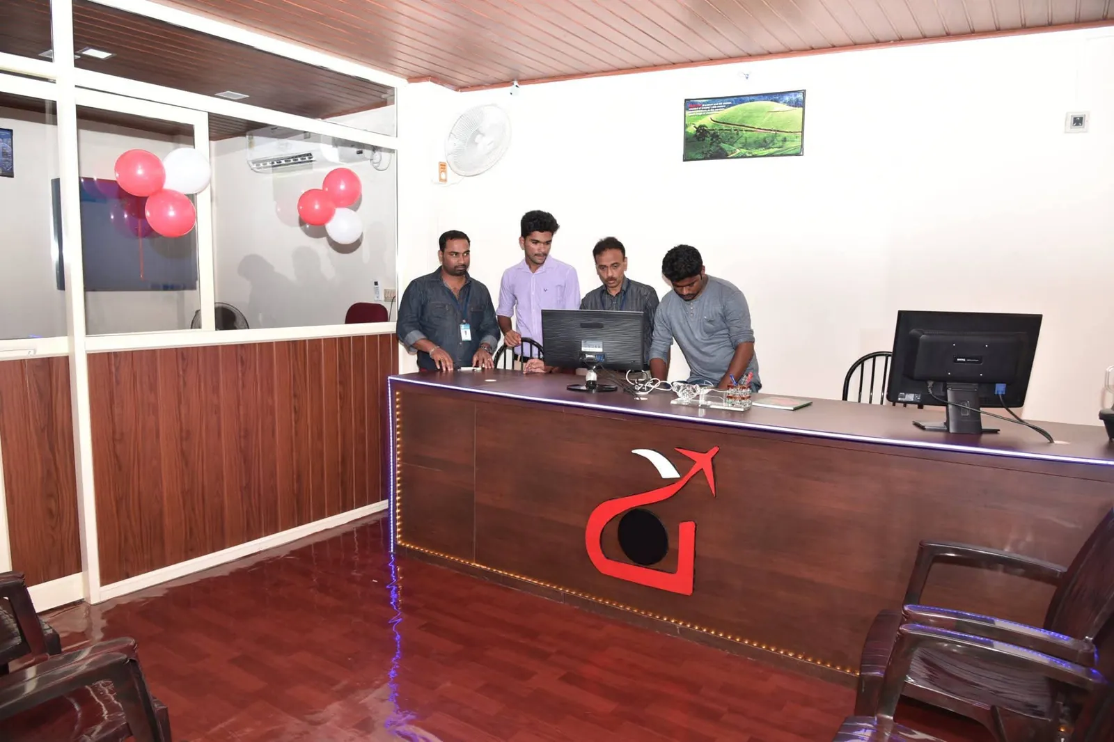 Anshaj Travels team at the new office reception desk