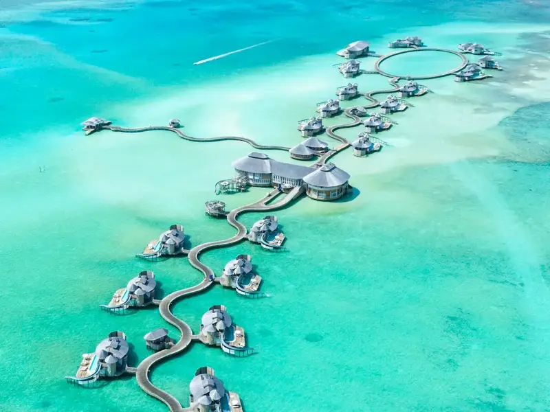 Overwater villas on a turquoise lagoon